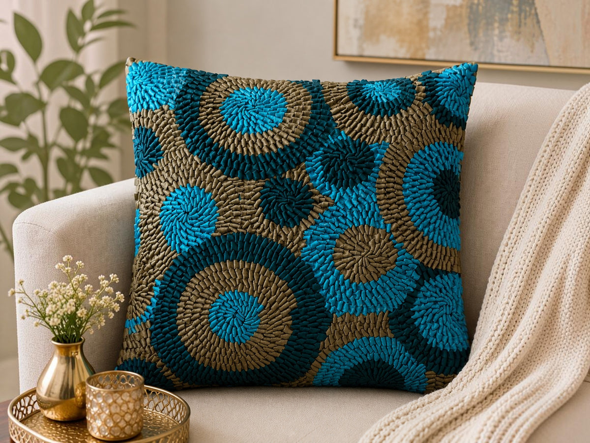 Jagdish Store decorative Cusion cover with teal, turquoise, and bronze fabric ribbons in concentric circles.