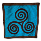 Jagdish Store turquoise throw pillow cover with a brown triskele spiral pattern and matching border.