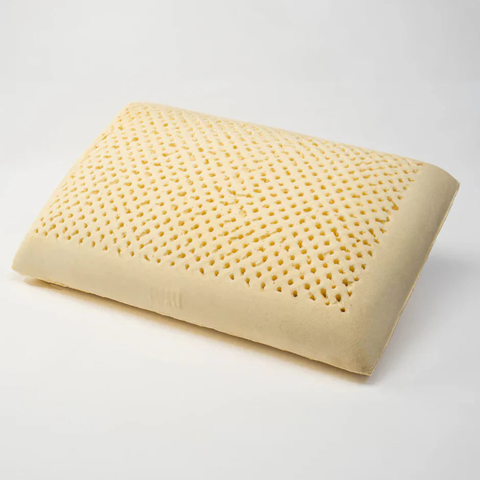 Uncovered natural latex pillow core showing its pincore ventilation holes