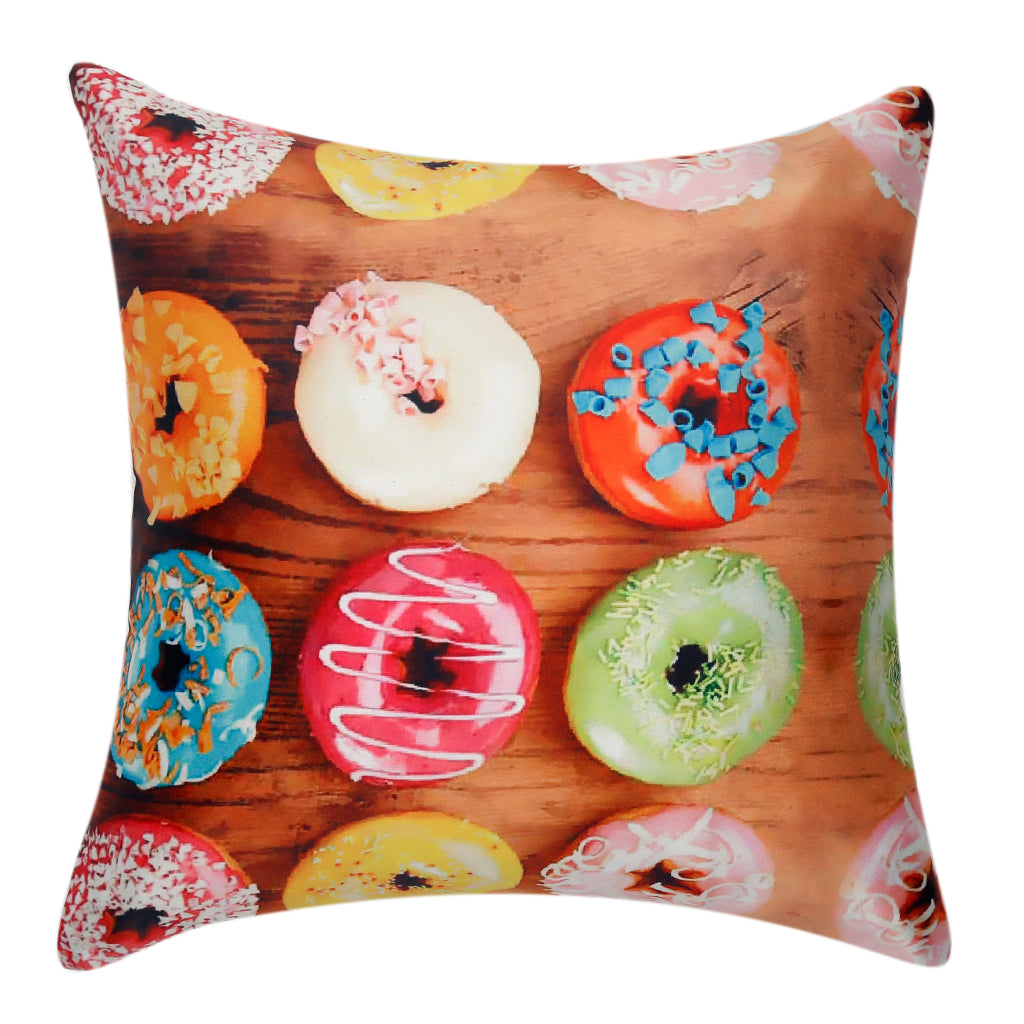 Cushion cover printed with iced doughnuts in bright colours on a wooden background