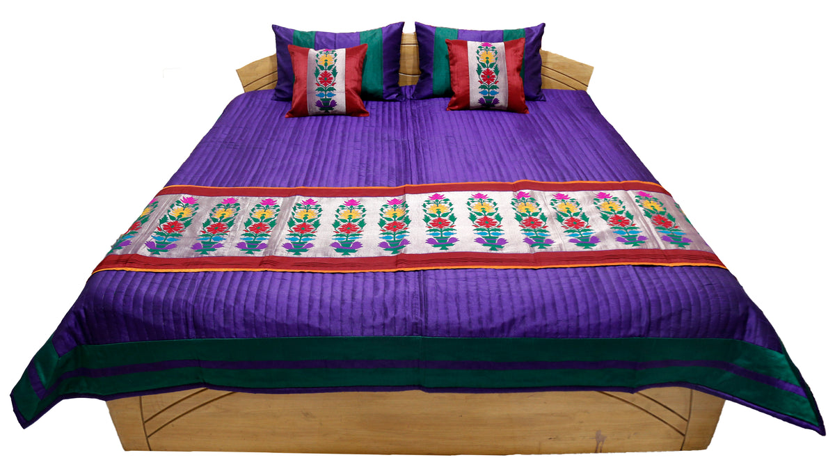Purple side of the reversible bedcover shown flat