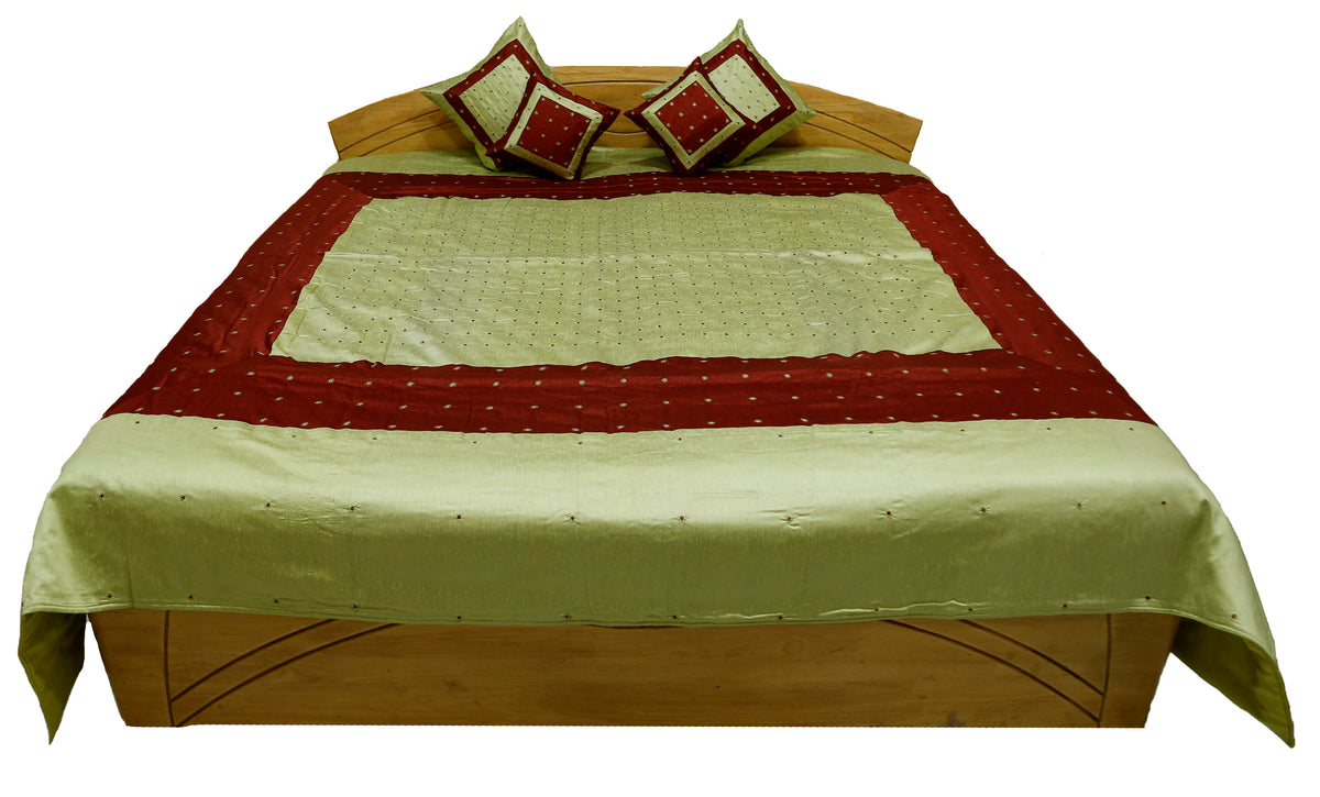 Pistachio and maroon bedcover with two mirror work cushion covers, straight view