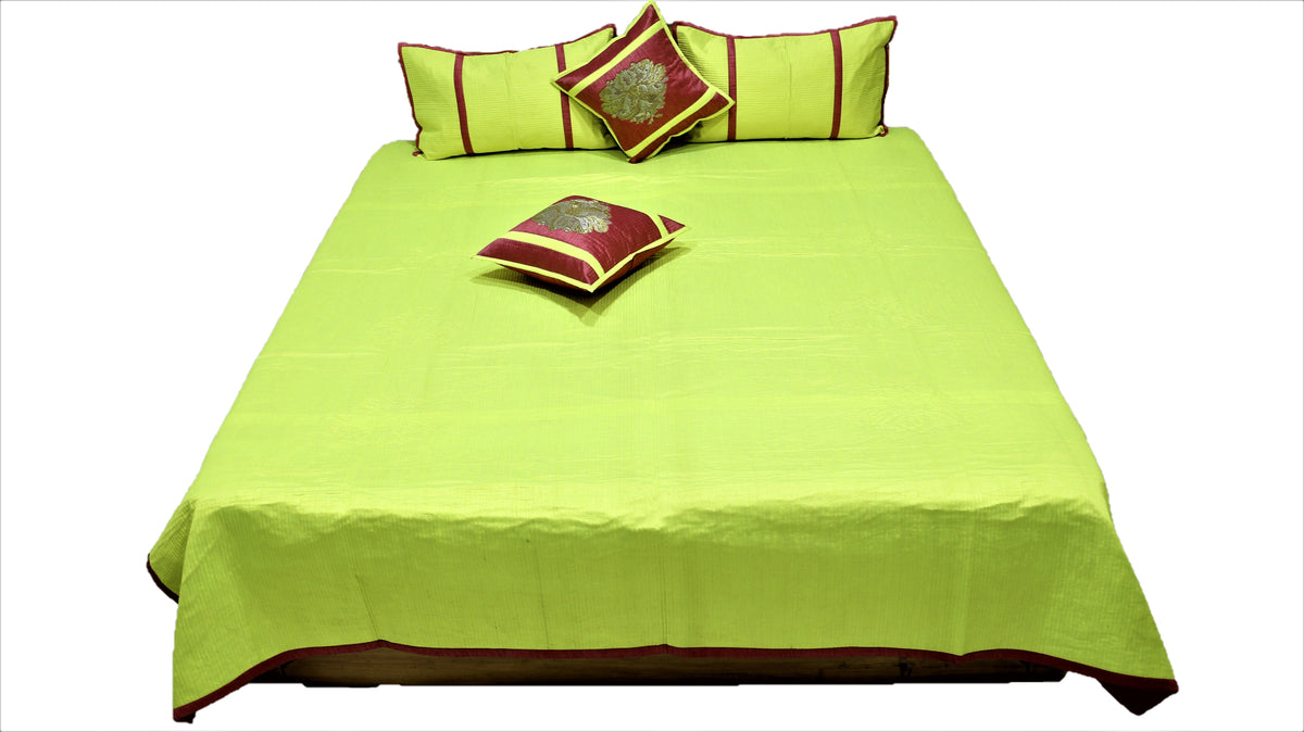 Lime green reverse laid flat with maroon and gold zari cushion covers