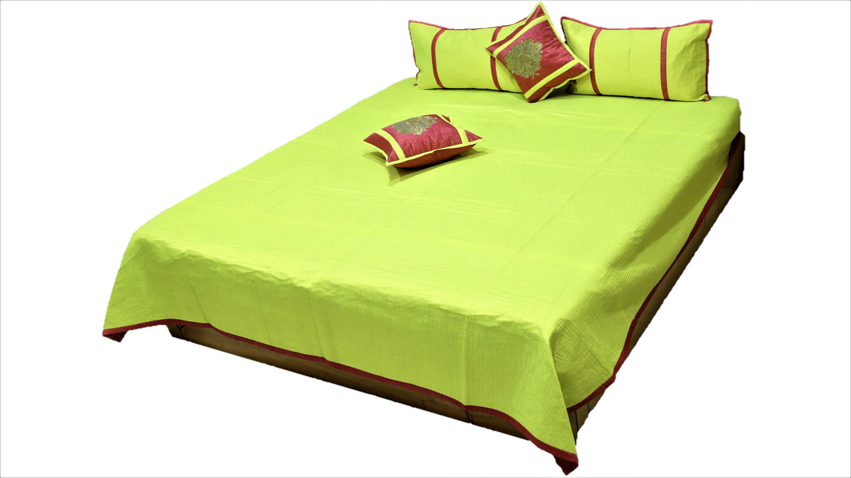 Lime green reverse side of the bedcover with maroon and gold zari cushion covers