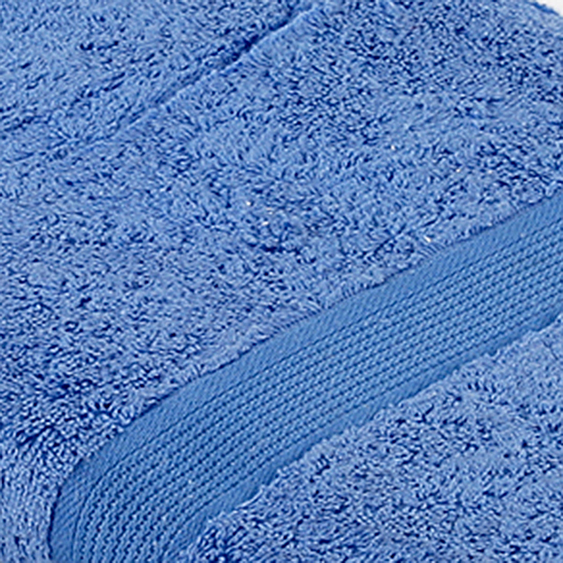 Blue cotton bath towel folded texture view