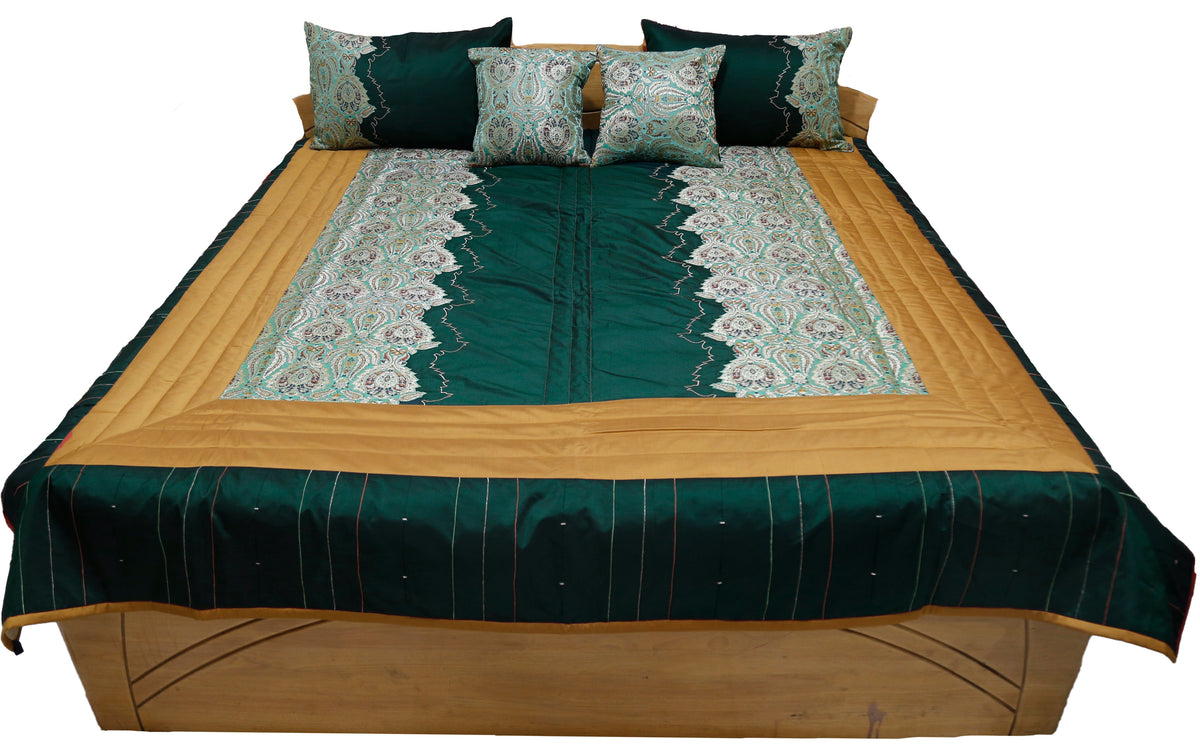 Teal and gold bedcover with paisley brocade pillow and cushion covers, straight view
