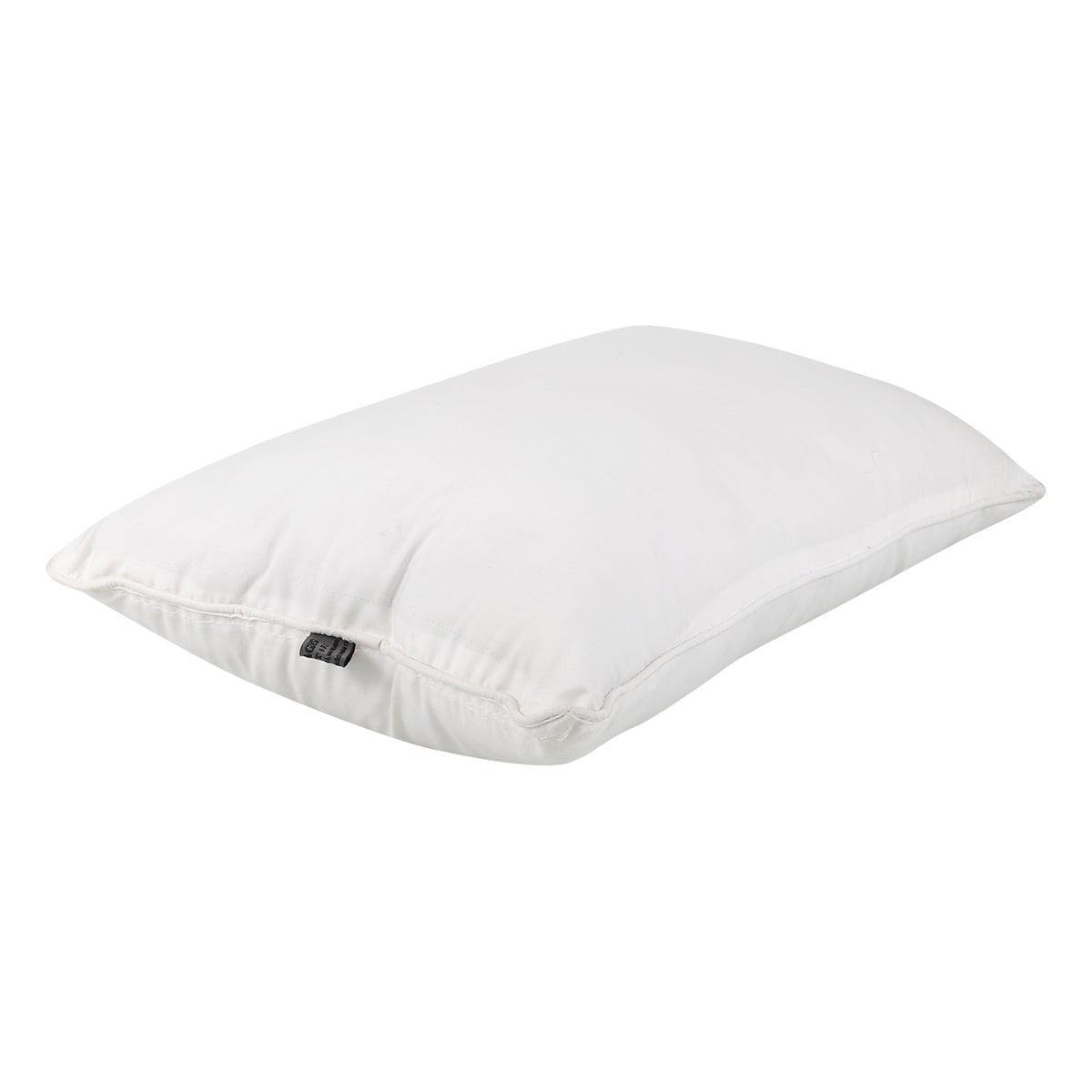 White piped polyfill pillow insert lying flat, showing the loft of the filling