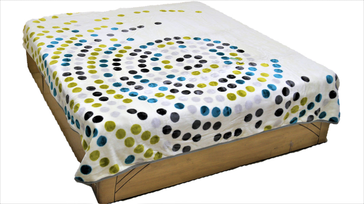 White-cream blanket with a swirled spiral polka-dot pattern in black, teal-blue, olive-green, and light-grey circles