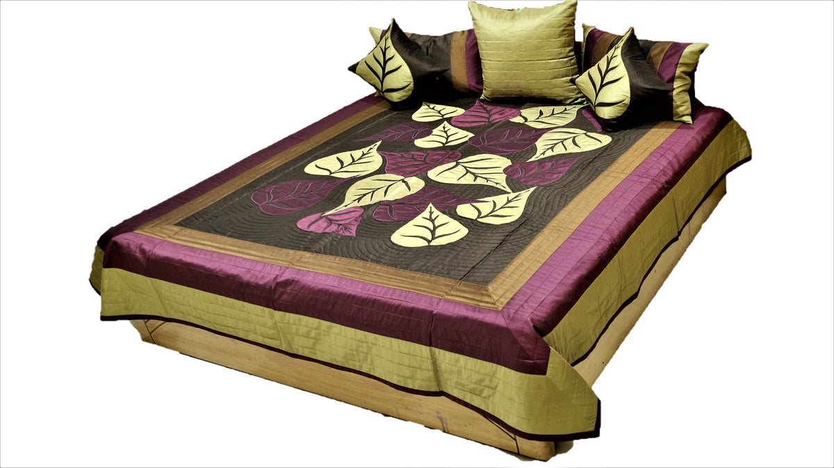 Brown silk bedcover with cream and aubergine leaf applique, olive border, angled view