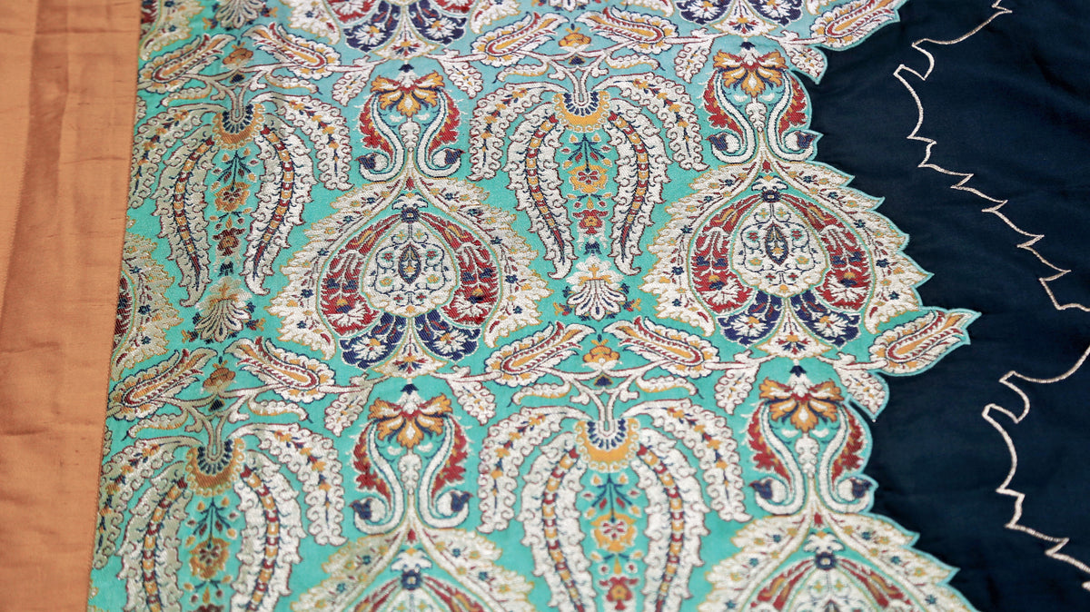 Turquoise paisley brocade panel edged with white scallop embroidery on navy silk