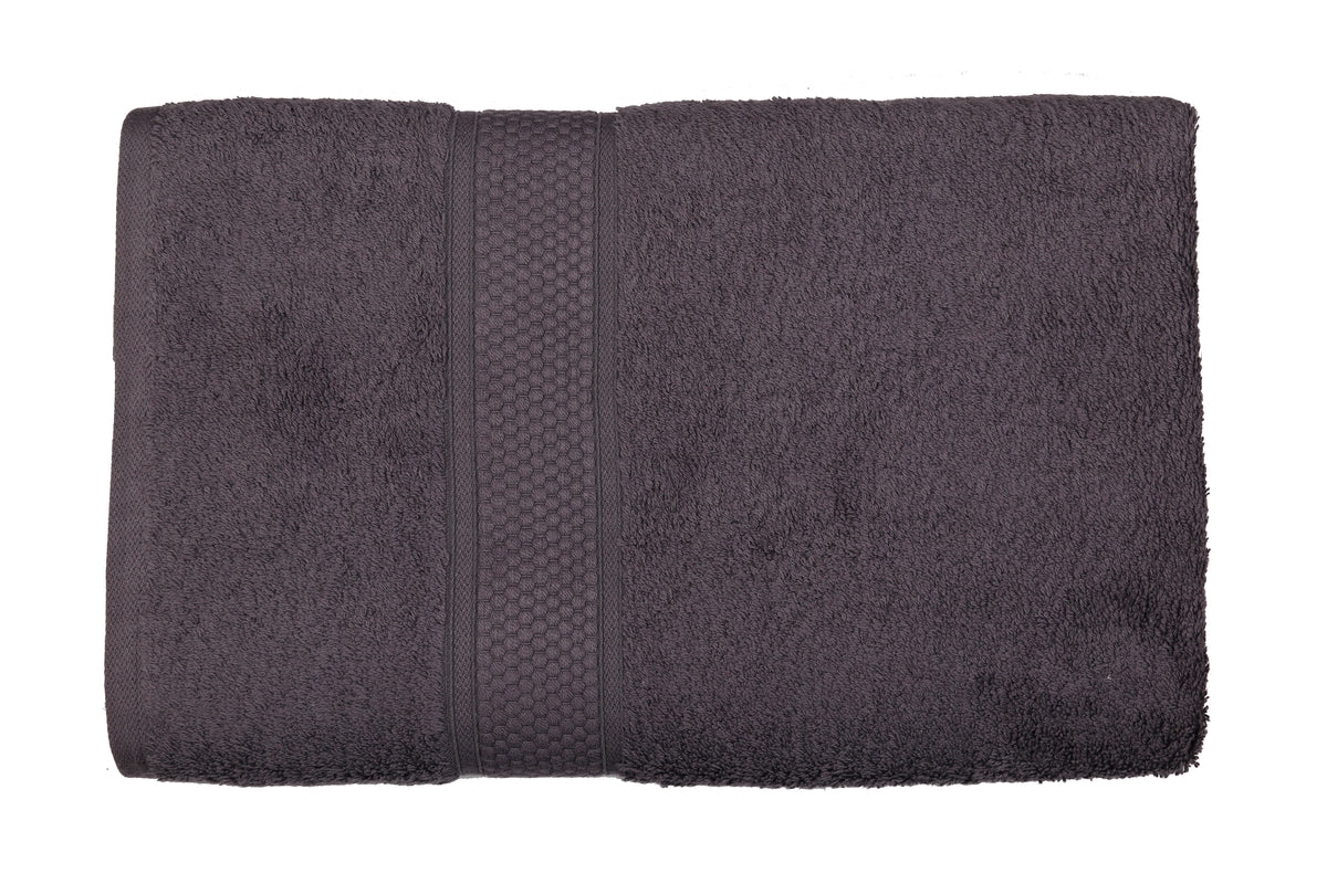 Charcoal-grey cotton bath towel, close-up rolled view showing the honeycomb woven border