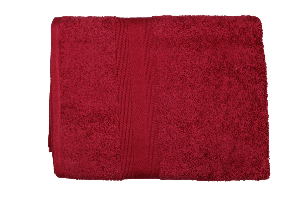 Deep maroon-red cotton bath towel, close-up rolled view showing the woven dobby border