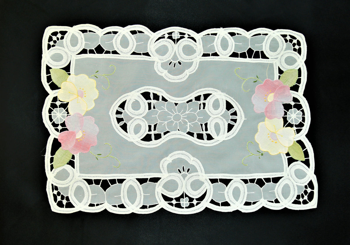 White organza table mat cutwork lace detail close-up