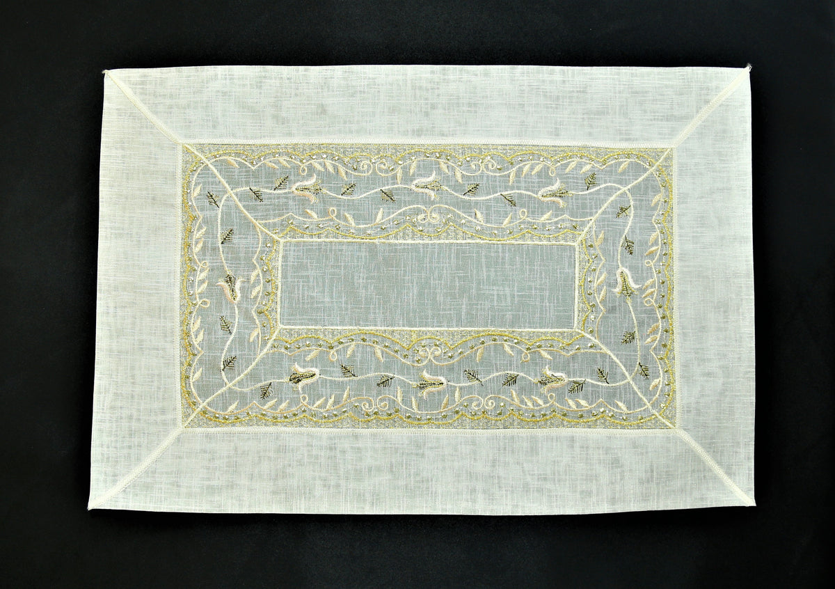 Cream tissue table mat embroidery stitch detail close-up