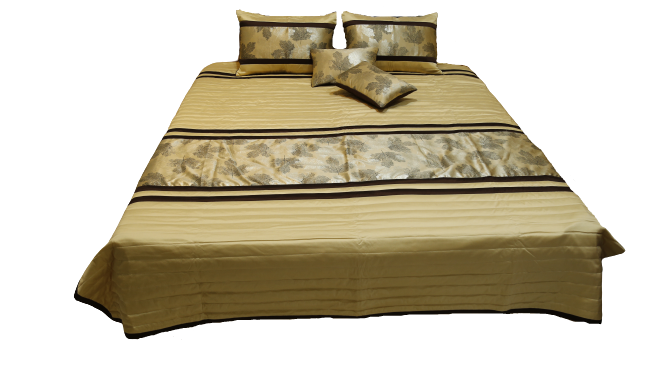 Gold striped bedcover made up with leaf-print shams and cushions, Silk Ambi