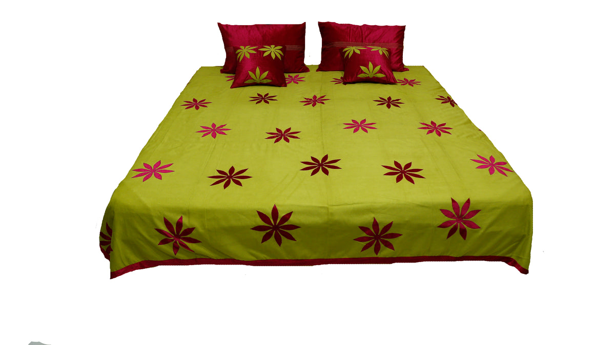 Lime green bedcover with maroon appliqué flowers and maroon cushions, Sued