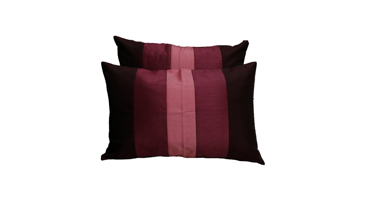 Two maroon and pink colour block striped cushion covers from the lotus set