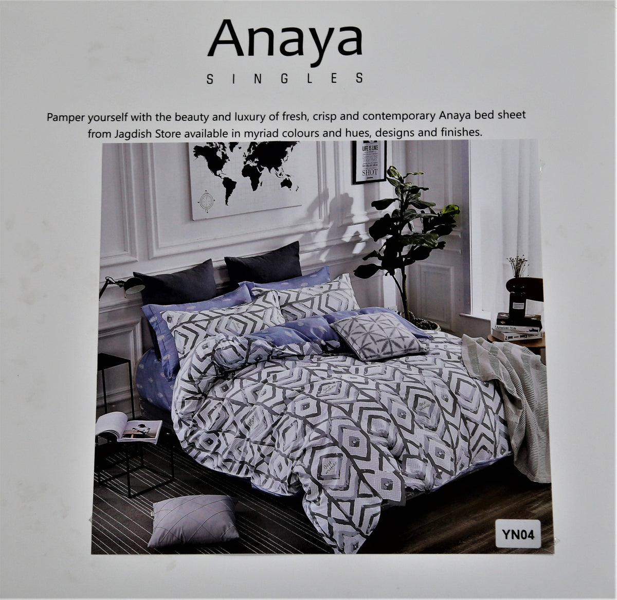 Anaya Singles packaging showing a lavender-grey and black diamond geometric printed bedding set styled on a bed