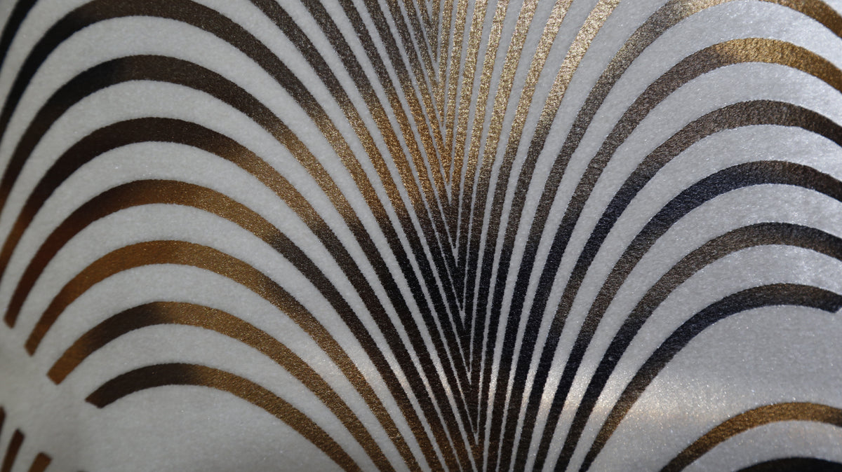 Close up of the black and gold foil printed fan arches on cream velvet