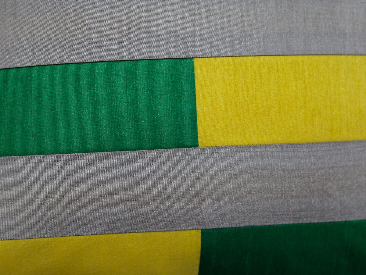 Close up of the grey, green and yellow pieced colour blocks and their seams
