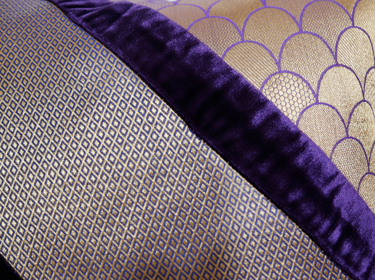 Close-up of the gold scallop and diamond brocade beside the purple velvet band