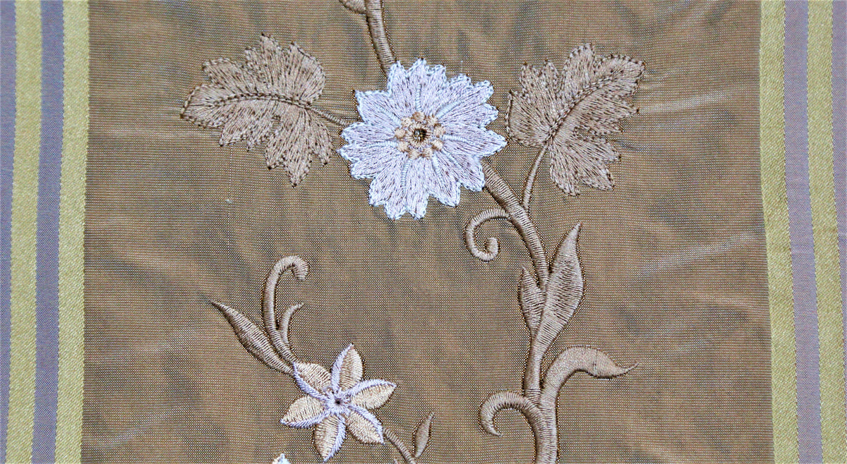 Bronze-brown silk upholstery fabric with a white embroidered floral vine