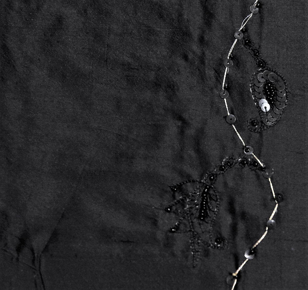 Black polysilk upholstery fabric with tone-on-tone sequin and bead embroidered vine