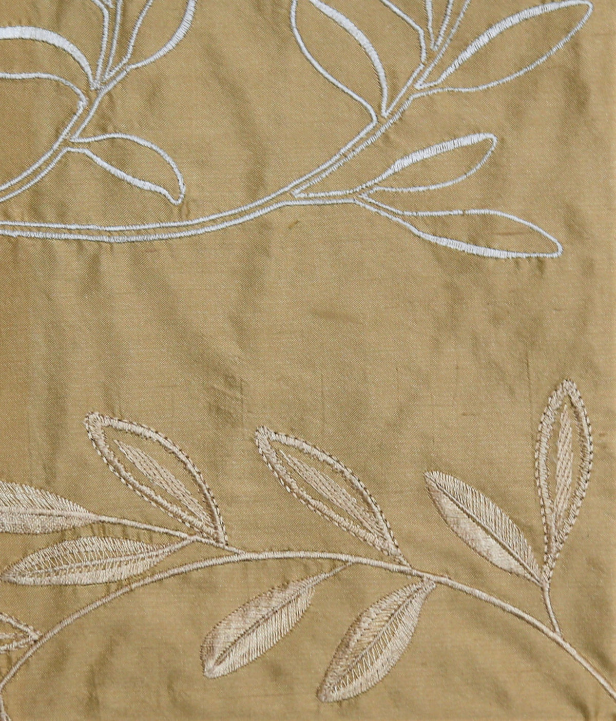Tan silk upholstery fabric with a tone-on-tone embroidered leaf vine