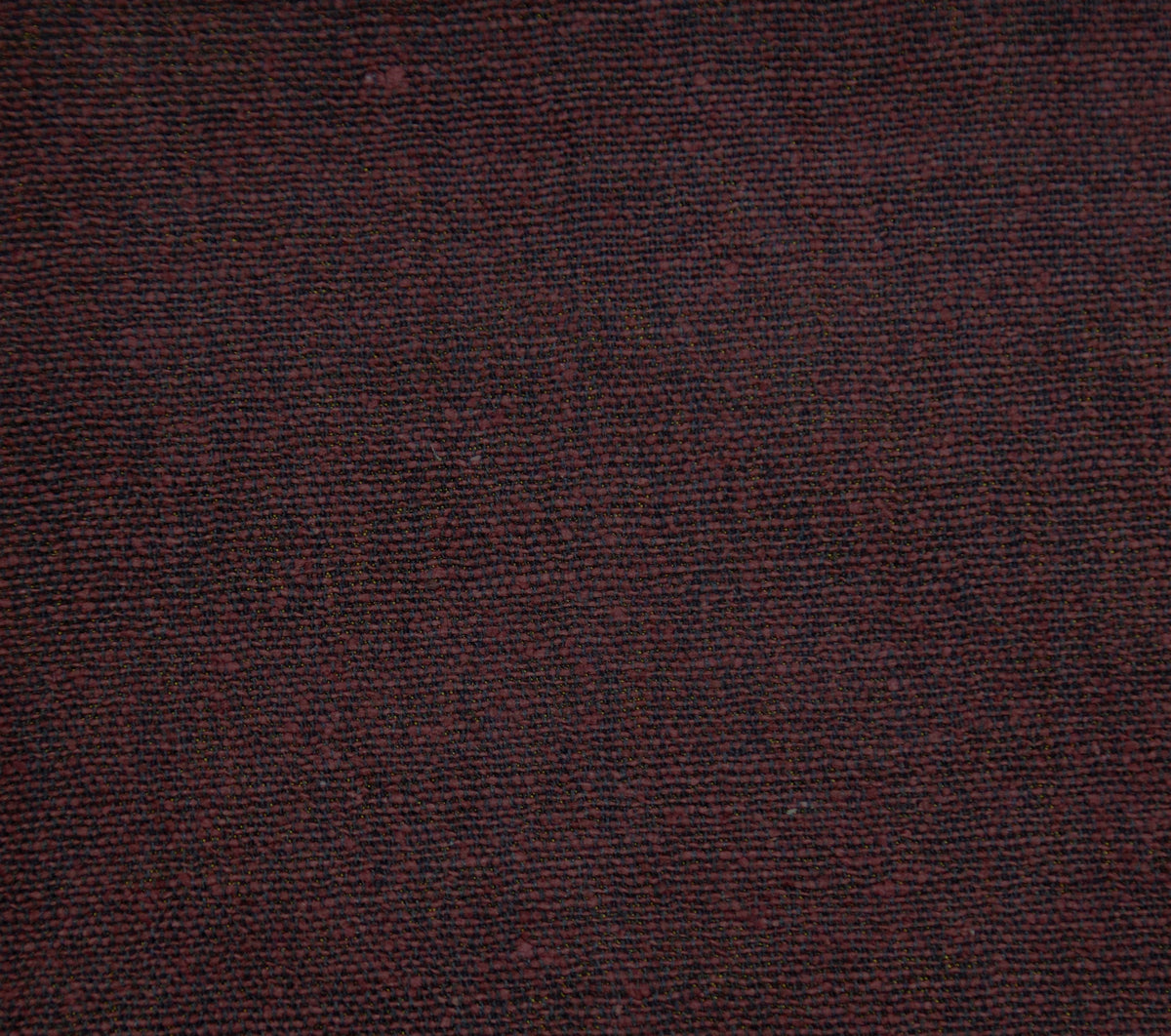 Maroon jute upholstery fabric with a firm, textured weave
