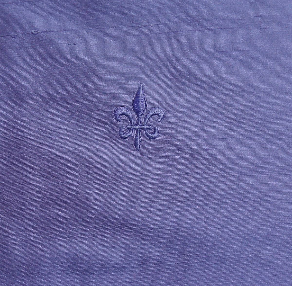 Lilac silk upholstery fabric with a tone-on-tone embroidered fleur-de-lis motif