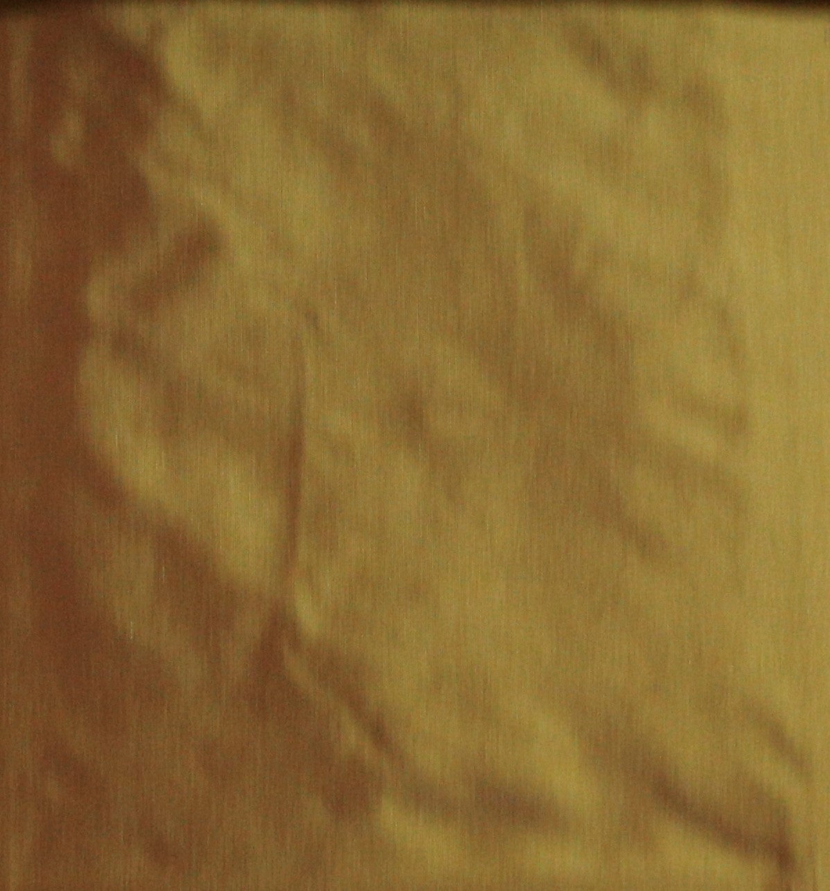 Golden silk upholstery fabric in a plain, even colour