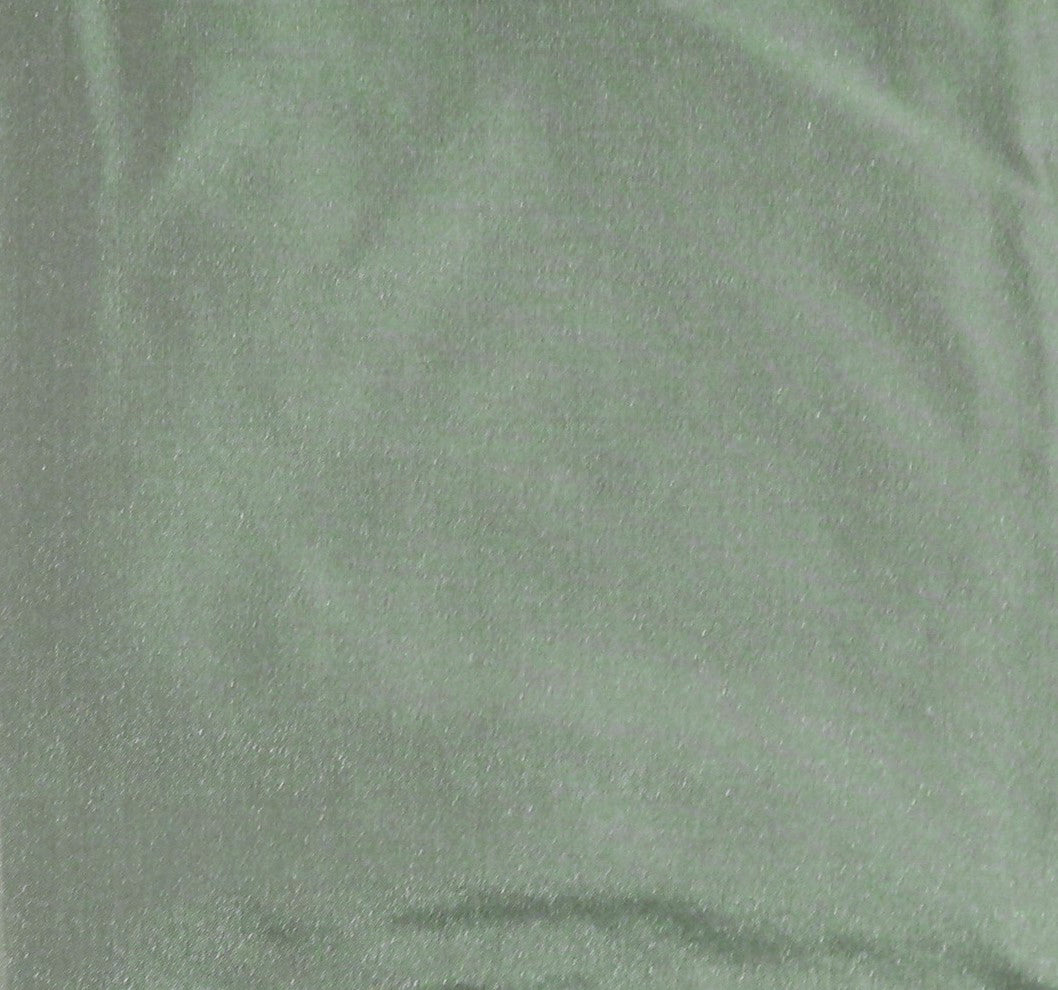 Pista green silk upholstery fabric in a plain, even colour