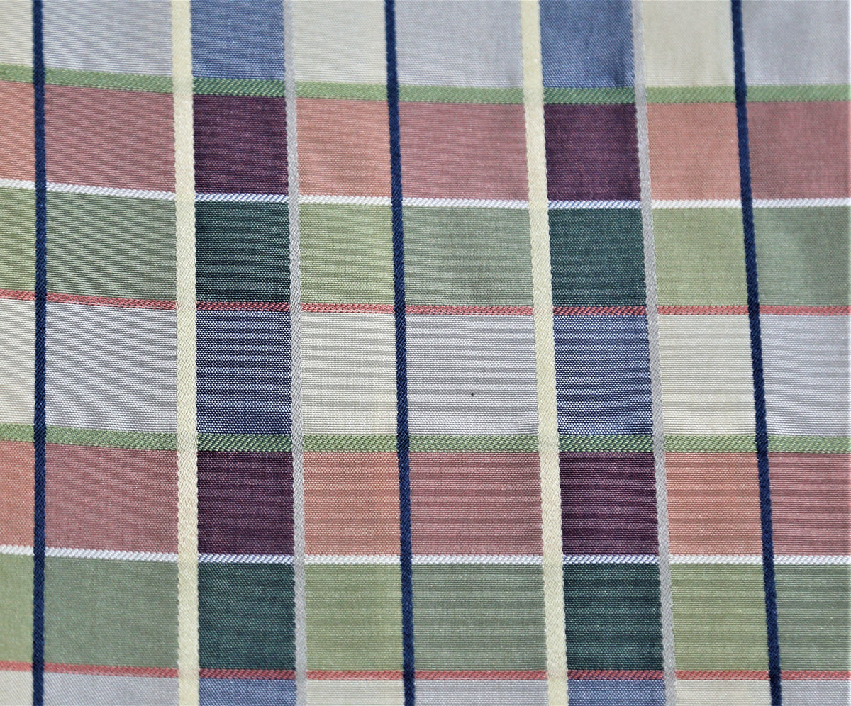 Satin plaid silk fabric in dusty blue-grey, sage green, and mauve tartan check with red, white, and black pinstripe accents