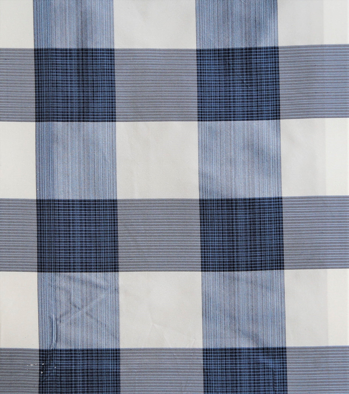 Taffeta silk upholstery fabric swatch in navy blue and cream check