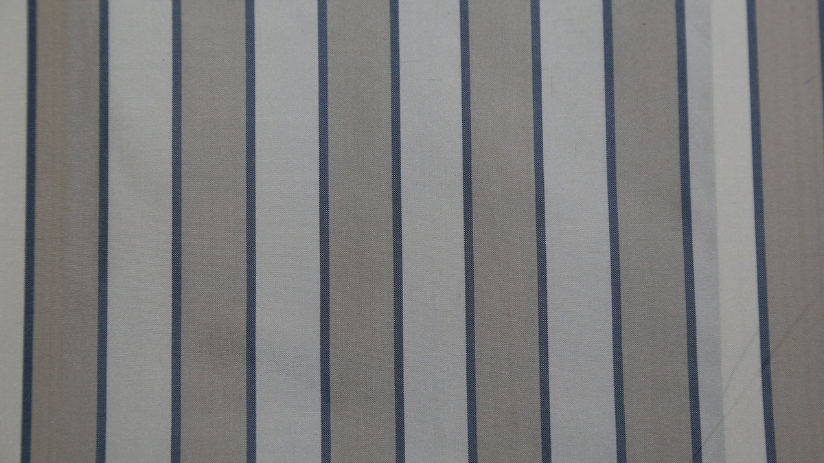 White and taupe silk upholstery fabric with a navy pinstripe