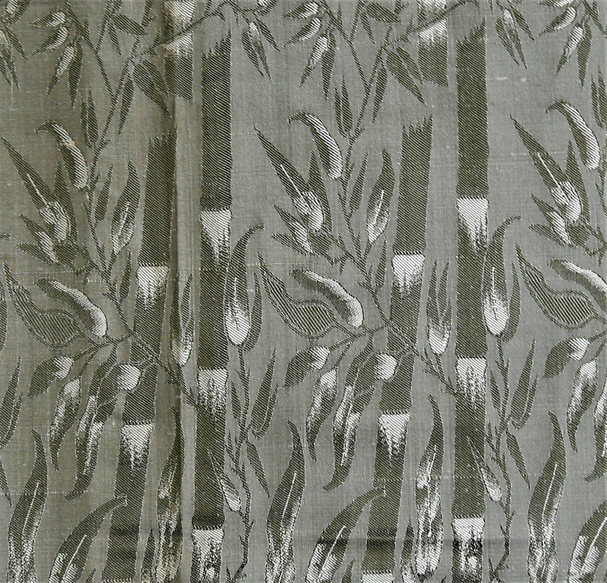 Sage-green silk upholstery fabric with an olive-green leaf-vine brocade