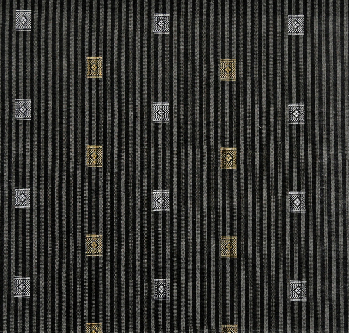 Charcoal-black silk upholstery fabric with gold and silver woven medallion motifs on a fine pinstripe