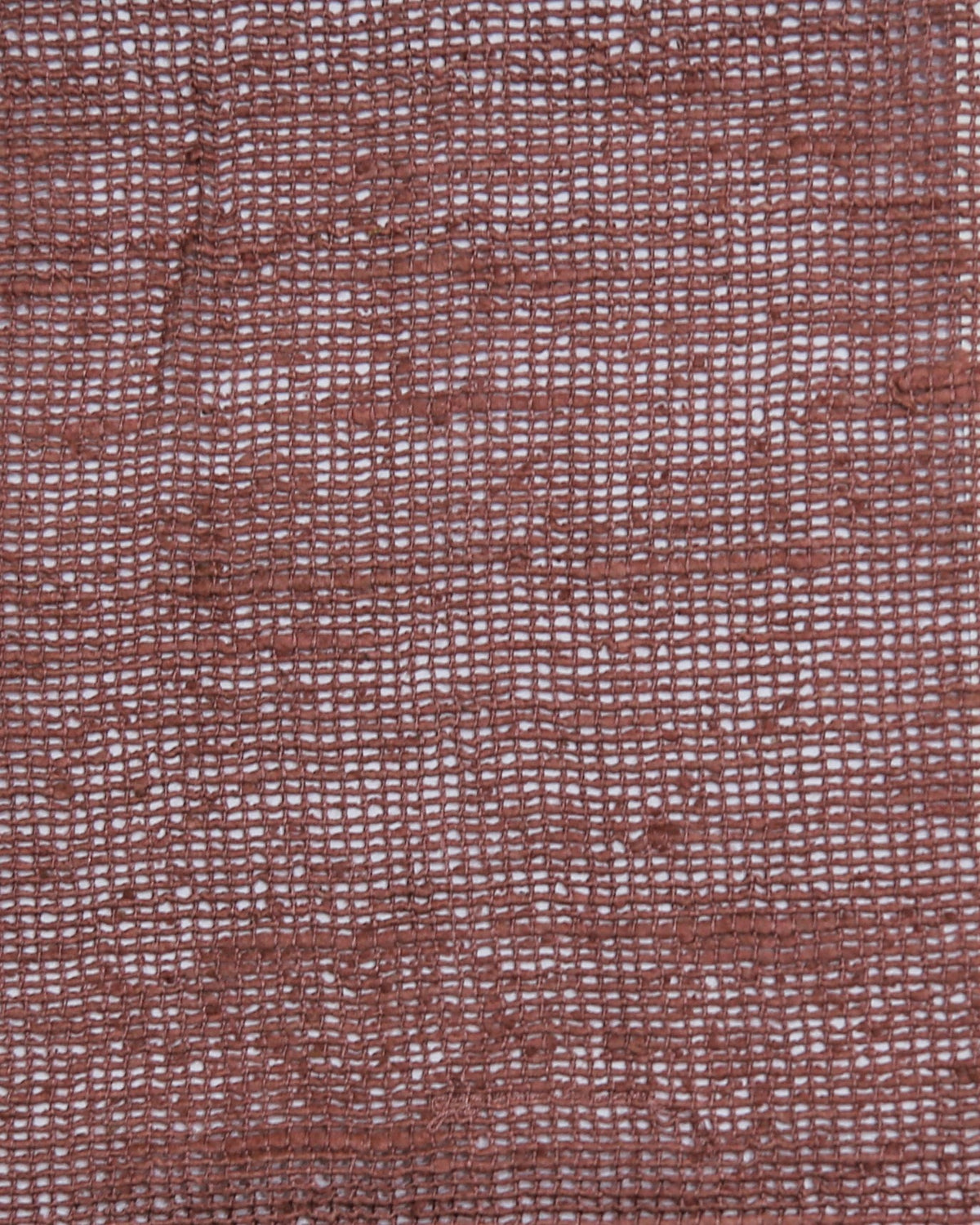 Dusty rose silk upholstery fabric in an open sheer weave