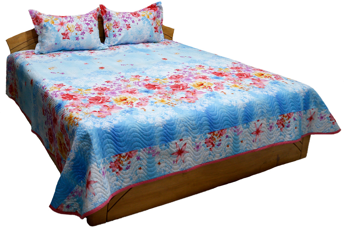 Sky blue floral printed cotton bedcover with rose border and two pillow covers, angled