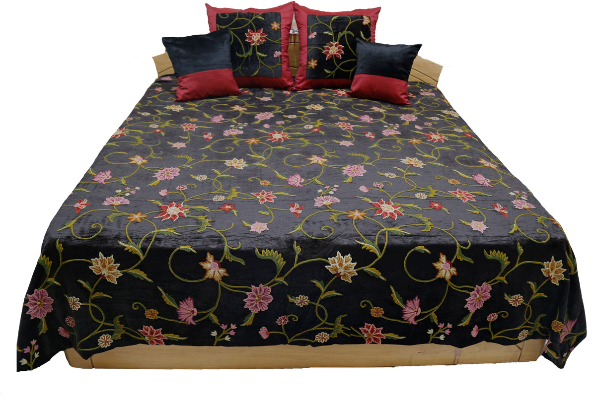 Black velvet double bedcover with a multicolour crewel floral embroidery, front view showing the 4 cushion covers