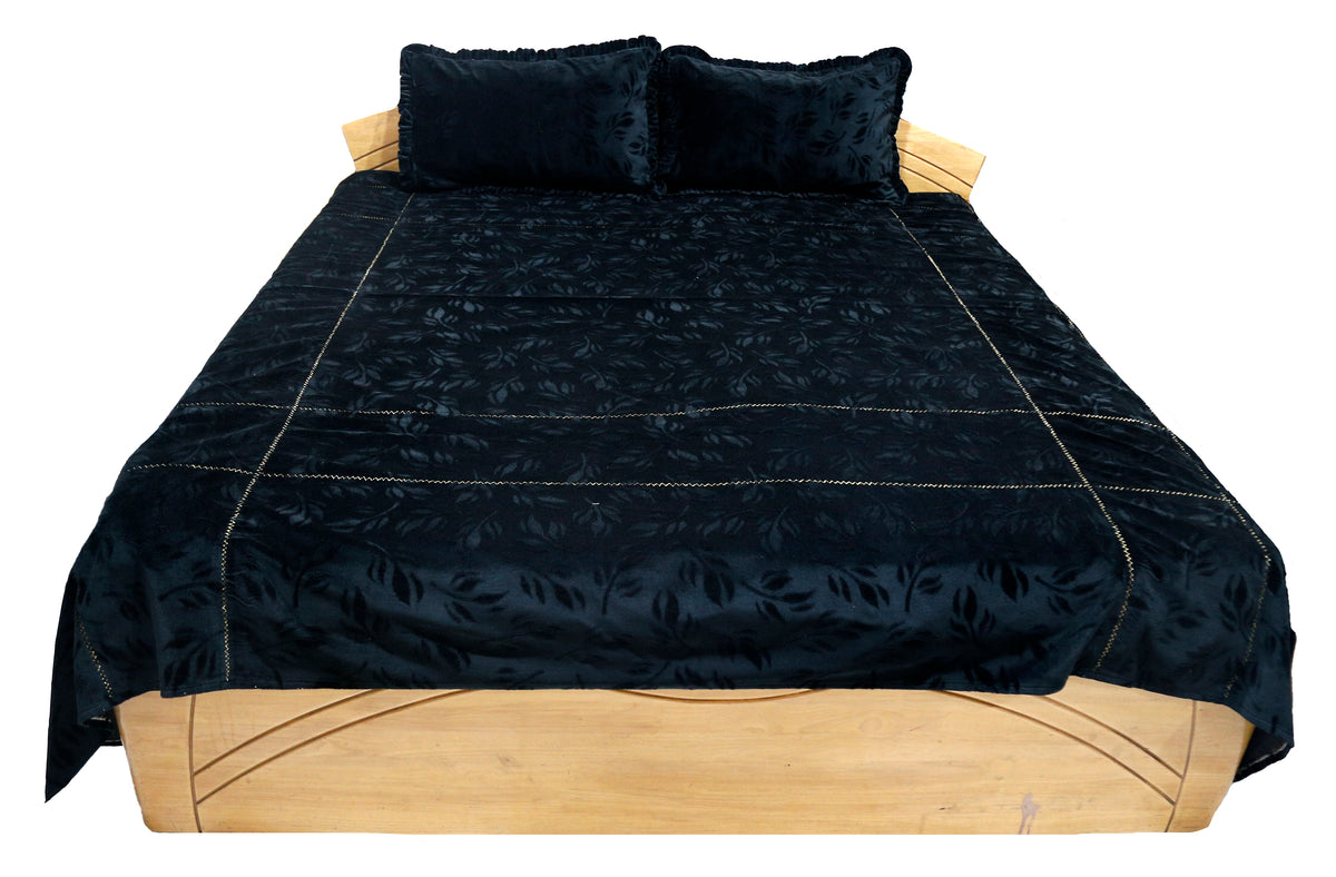 Black bedcover with an embossed woven leaf pattern, front view showing the 2 pillow covers
