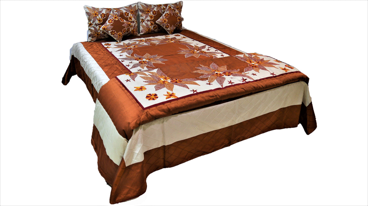 Rust brown and cream wedding bedcover set with white floral embroidery on a double bed