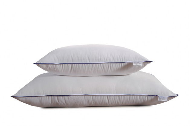 Two Homescapes Cloud pillows stacked, showing the navy piped edge